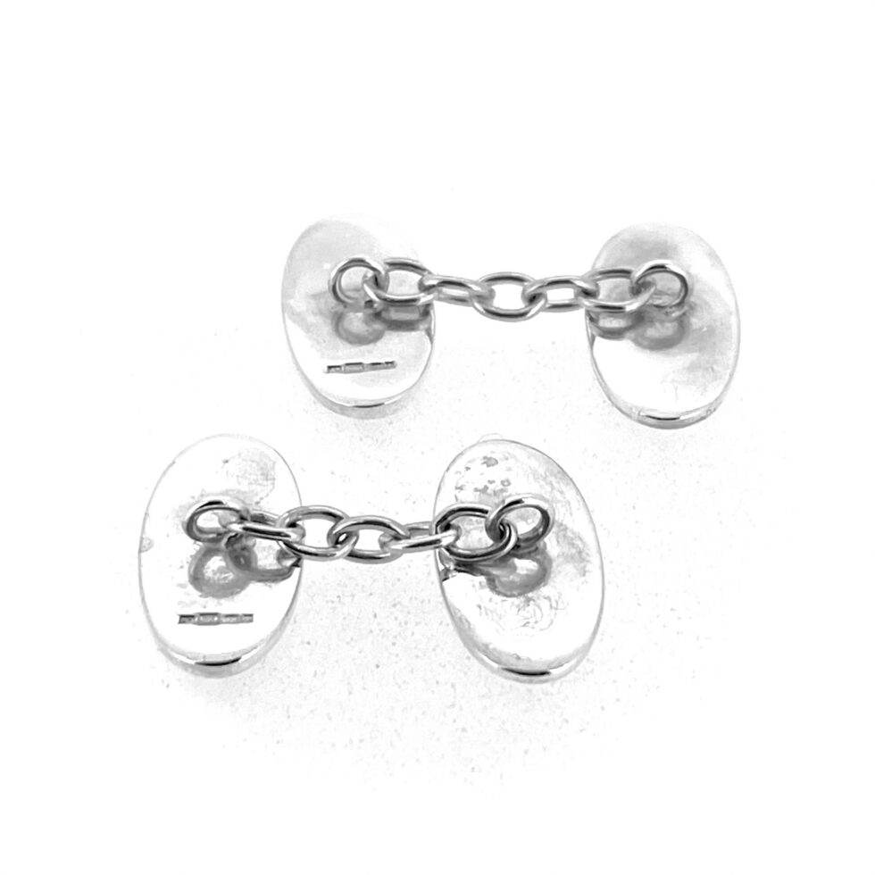 Hallmarked sterling silver cufflinks with Celtic Revival inspired design and original vintage backs
