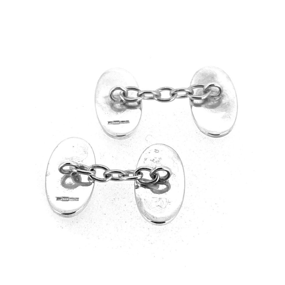 Hallmarked sterling silver cufflinks with Celtic Revival inspired design and original vintage backs