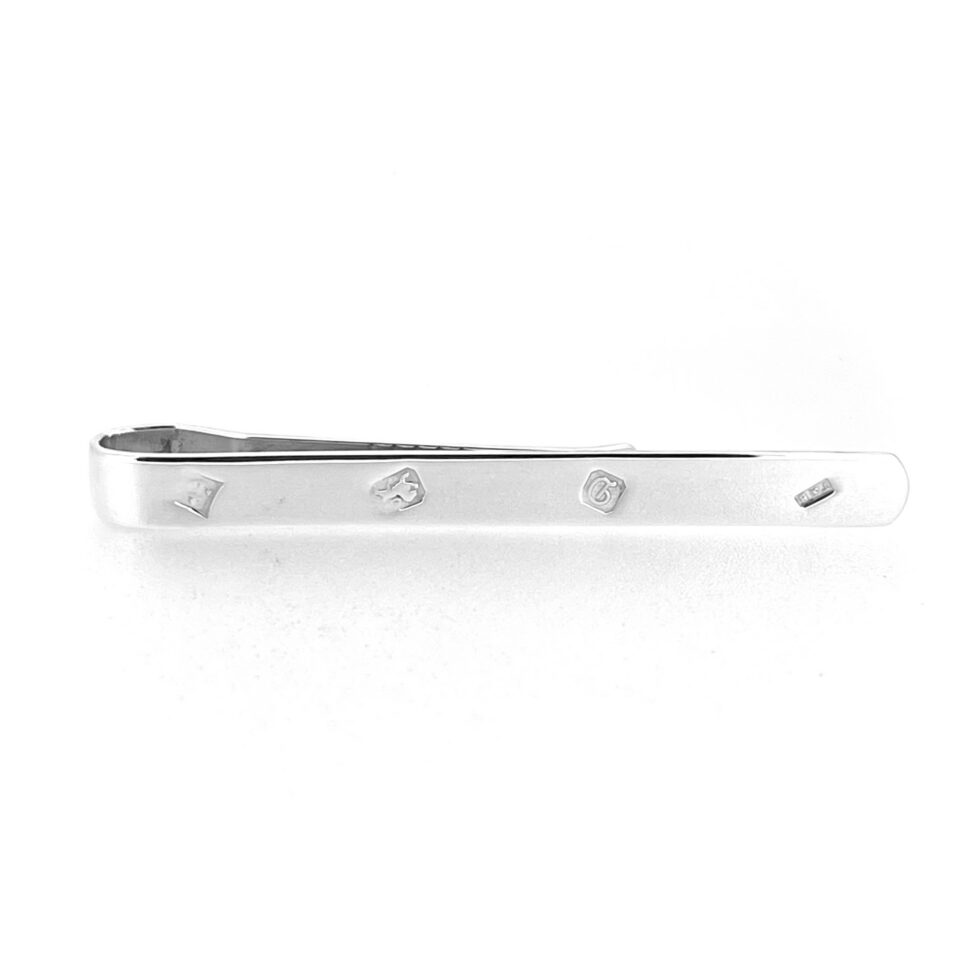 Clean polished vintage silver tie clip with visible date letter D