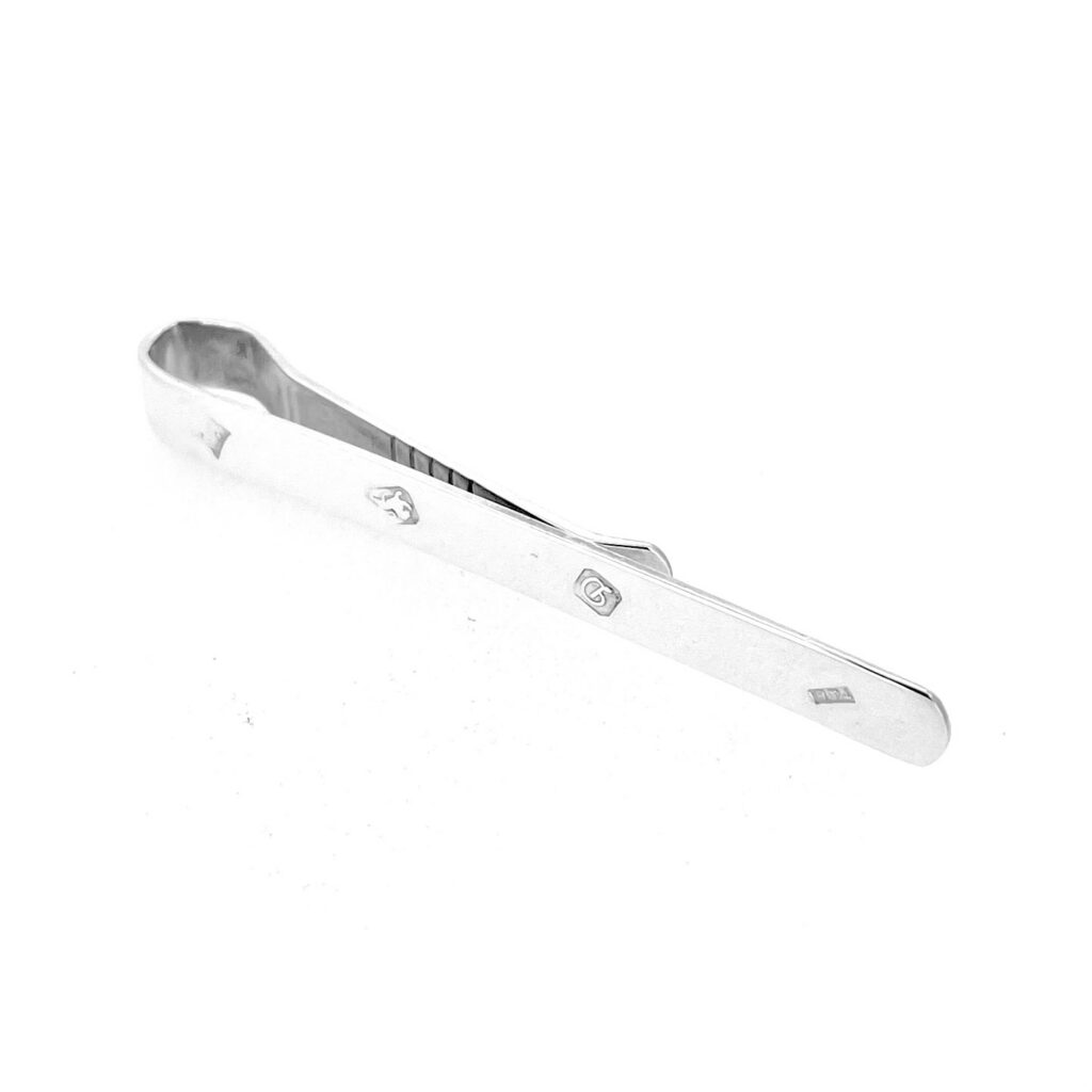Front view of vintage sterling silver tie clip with visible assay marks